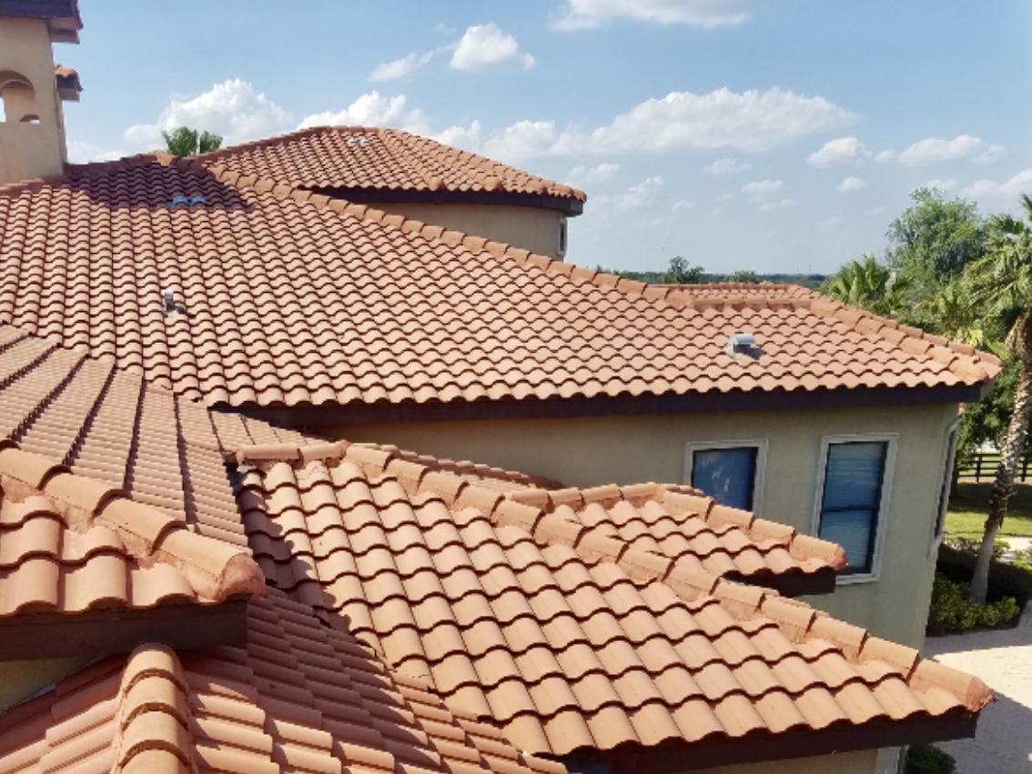 A roof with some brown tiles on it